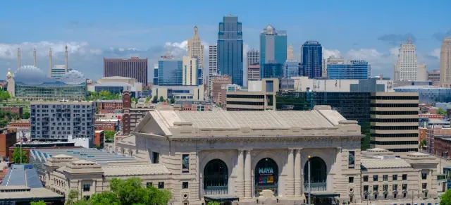Union Station with the downtown Kansas City skyline behind it on a sunny day