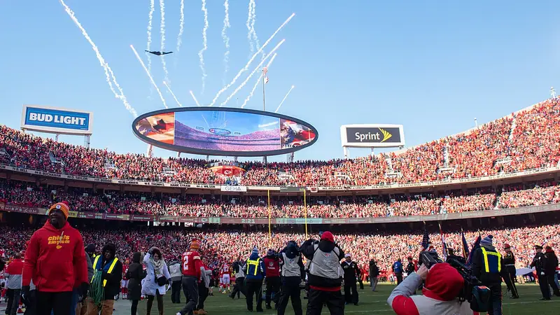 Arrowhead Stadium on game day with a B-2 bomber flyover