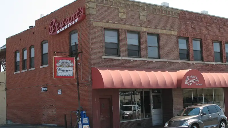 The red brick Arthur Bryant's Barbeque building at 18th and Brooklyn, with its red awnings and Bryant's sign