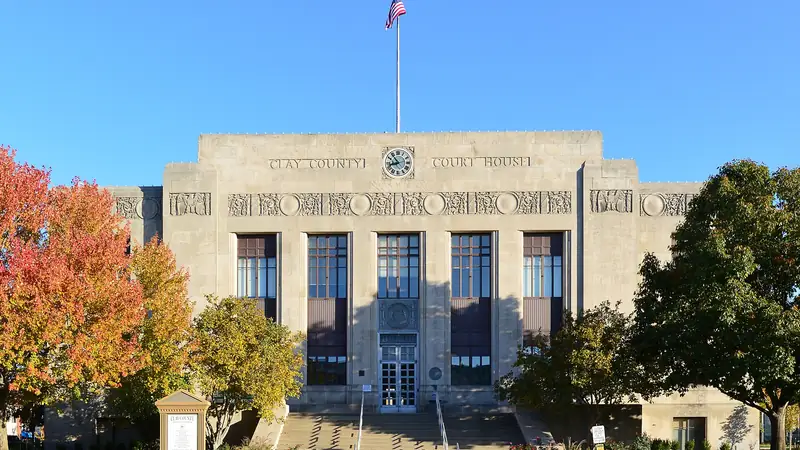 The Art Deco Clay County Courthouse on Liberty's historic square, framed by autumn trees