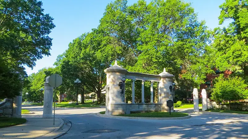 A stone gateway and shade trees in the Hyde Park neighborhood