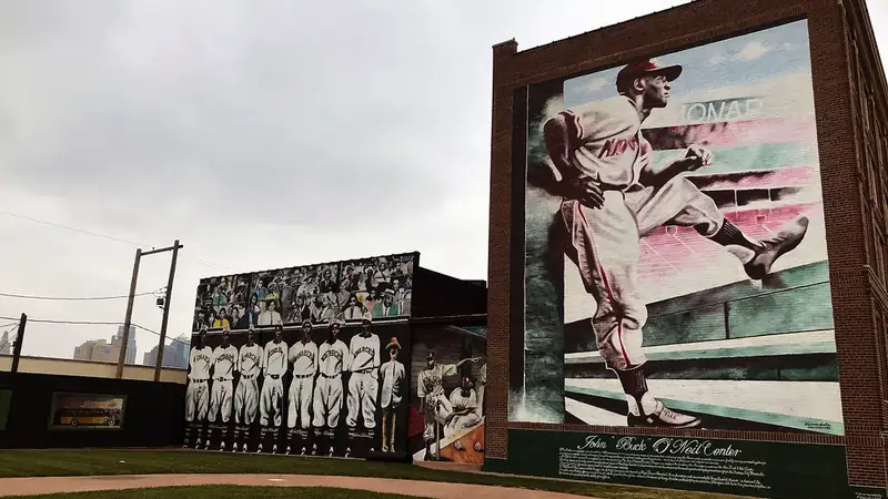Giant Negro Leagues baseball murals on brick buildings in the 18th & Vine Jazz District