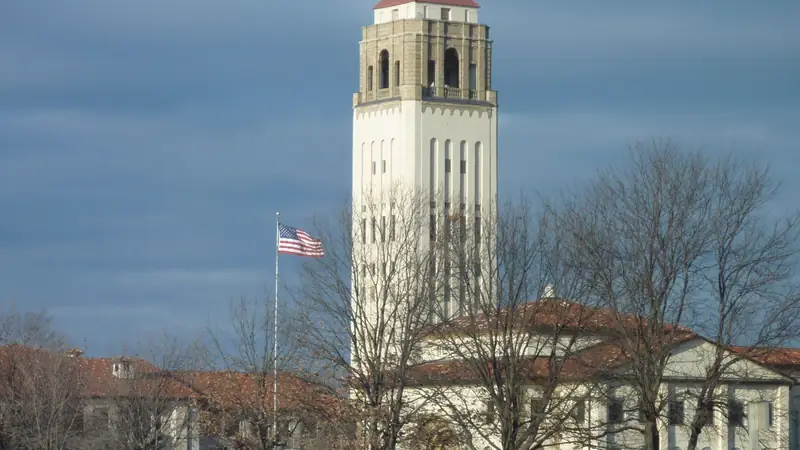 The tall white Unity Village tower rising over red tile roofs on the Unity Village grounds