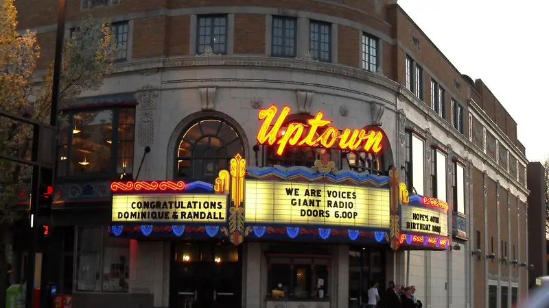The lit Uptown Theater marquee on Broadway